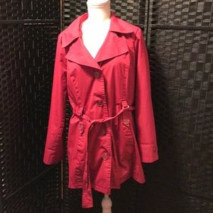 Women’s jacket with small hole under right sleeve where the thread came a loose.